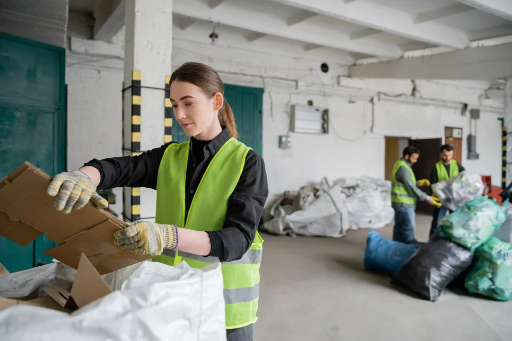 young-female-worker-in-protective-vest-and-gloves-2024-11-08-13-19-20-utc